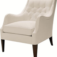 A white Ludlow lounge chair with softly diamond-tufted back resting on elegantly on tapered posts and Dark Walnut finish.