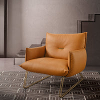 A leather armchair set on an elegant tubular base.