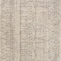 Odyssey Natural + Ash Area Rug that draws inspiration from tribal influences and combines relaxed linear pattern with a sophisticated color palette.