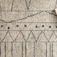 Odyssey Natural + Ash Area Rug that draws inspiration from tribal influences and combines relaxed linear pattern with a sophisticated color palette.