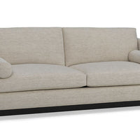 Grey two seat Oscar Sofa that features a slim tuxedo style, foam and down seats, arm bolsters and parson legs. Front view.