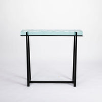 Cooper Console with subtle tapered legs and green facet glass top.