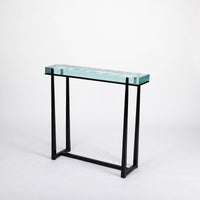 Cooper Console with subtle tapered legs and green facet glass top.
