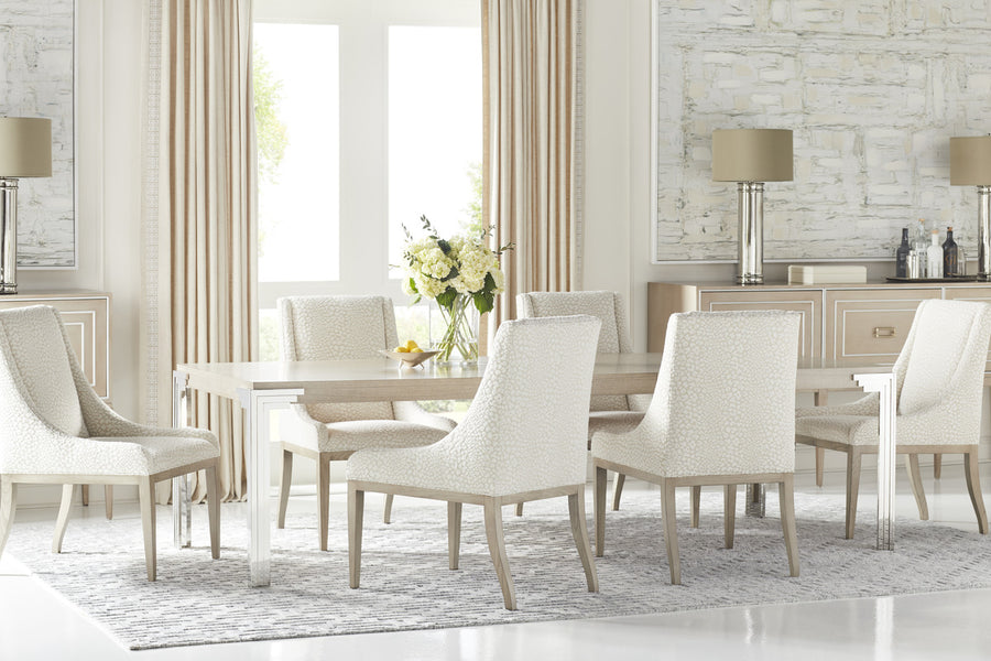 Marler storage cabinet placed in a dining room with a big dining table and six white dining chairs.
