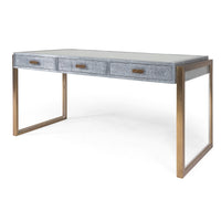 Brooklyn Desk finished in shagreen metal, supported by brass wrapped rectangular legs, and with three drawers.