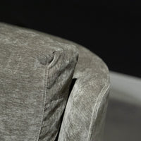 Grey two seat Fisher sofa with soft curved outside back, wood perimeter detail and casual comfort. Closed up view.