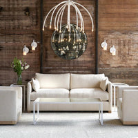 White two seat Dexter sofa placed in a room with two white chairs and coffee table.