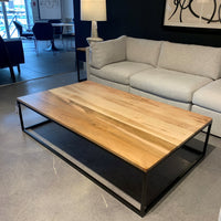 Avant Cocktail Table built with a solid steel base and solid wood top.