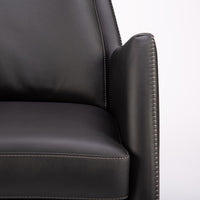 A black leather Kate swivel armchair. Closed up front view.