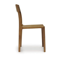 Lisse dining chair crafted in solid American black walnut hardwood and Made to Order in natural finish. Side view.