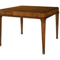 Julien Game Table crafted in solid maple with fine anegre veneers with a small drawer positioned near the left corner on all four sides and tapered legs that are topped with antique brass collars