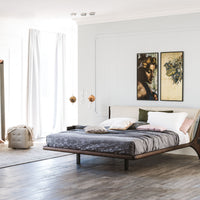 The Nelson designer modern king size bed with a light shape, placed in a modern room, front and side view.