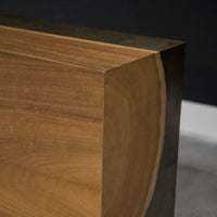 Yuka wood Kobe console with the anodized metal panels and toasted finish, closed up view.