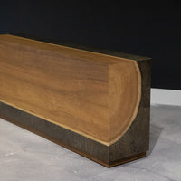 Yuka wood Kobe console with the anodized metal panels and toasted finish, side front view.