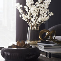 Erie Centerpiece Hand-carved of Natural Teak Root in Rich Ebony. Placed on a table with other decorative elements.