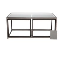 Metal nesting cocktail table consisting of glass top center table and 2 outer bunching tables, slide under the ends of the center table