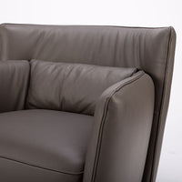Dark brown leather Tulip swivel armchair, endowed with a lower-back cushion. Closed up front view.