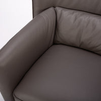 Dark brown leather Tulip swivel armchair, endowed with a lower-back cushion. Closed up top view.