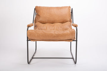 Brando contemporary lounge chair with industrial metal frame with a reclined back and plush feather down fill. Front view.