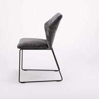 Black New York side chair with painted finish and fully removable covers. Side view.