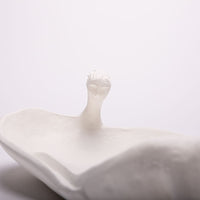 French White La Femme Baignoire (The Bathing Lady) sculpture cast in a biodegradable, eco-friendly stone composite containing no resin. Closed up view.
