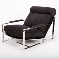 Dark grey Cruisin lounge chair with  a brushed bronze frame, cylindrical headrest and padded arms combined with the luxurious seat and back.