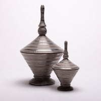 Two different sized Nifty Lidded ceramic Jars in silver metallic glaze.