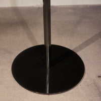 Cloe contemporary Floor Lamp in aged brass, with frame and base in lacquered metal and adjustable arm in lacquered aluminum. Closed up view on the base.