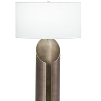 Jade Table Lamp with a white drum shade and organic silhouette body that combines with antique brass finish.