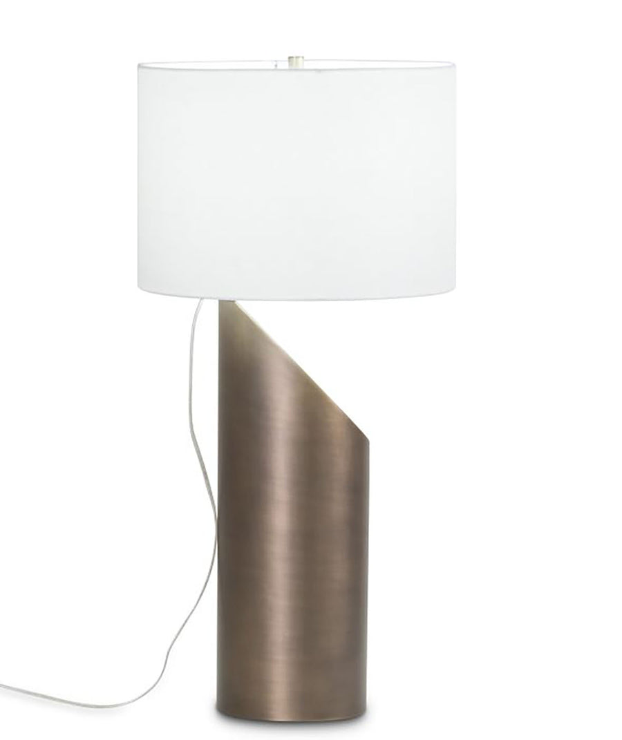 Jade Table Lamp with a white drum shade and organic silhouette body that combines with antique brass finish. Side view.