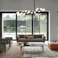 Ralph leather sofa, and two chairs placed in a room in a house beside a lake.