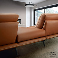 Closed up back view of orange leather Ralph sofa.