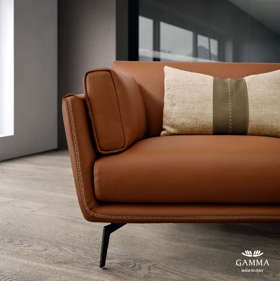 Closed up front view of orange leather Ralph sofa.