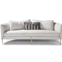 White Decked Out sofa with curved back and metal legs.