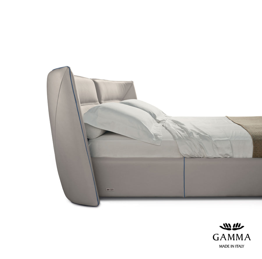 Tulip Leather-upholstered King Size bed in light colors, side view.