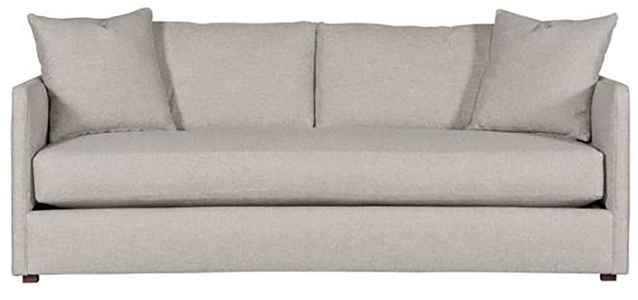 Light grey two seat Wynne Stocked Sofa with curved back and front and single seat cushion and 2 back pillows. Front view.