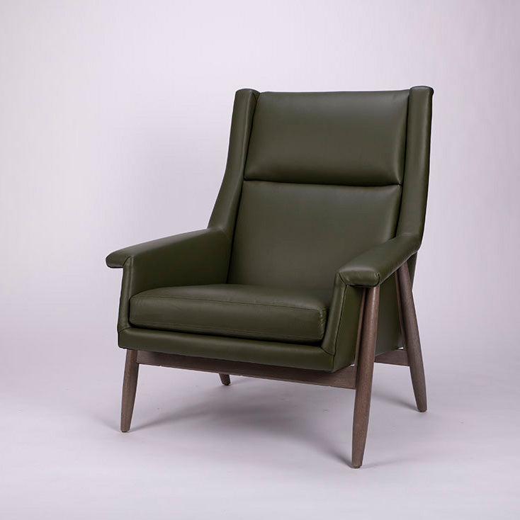 A green lounge chair designed in 1959 by Milo Baughman with solid walnut frame. Front and side view.