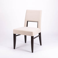 Blues Side Chair in white color fabric and dark legs, with open back.