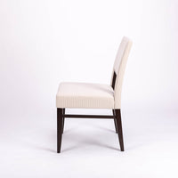 Blues Side Chair in white color fabric and dark legs, with open back, side view.