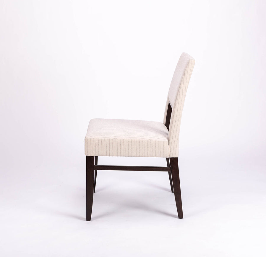 Blues Side Chair in white color fabric and dark legs, with open back, side view.