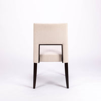 Blues Side Chair in white color fabric and dark legs, with open back, back view.