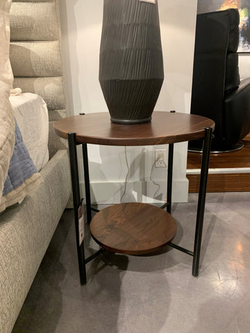Manhattan Side Table with the racetrack oval, asymmetrical silhouette, and unique joinery between metal, glass and wood pieces.
