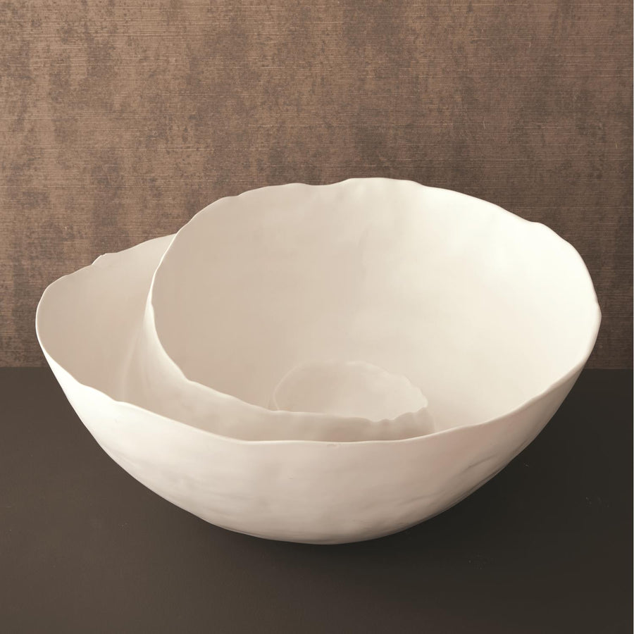 Spiral Bowl made of Portuguese ceramic with an matte white finish and  a swirling ridge that spirals from the outer edges of the bowl towards the center.