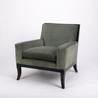 Curtis lounge chair in grey-green color with clean wood detail, softly splayed legs, and outside back framed by the wood trim.