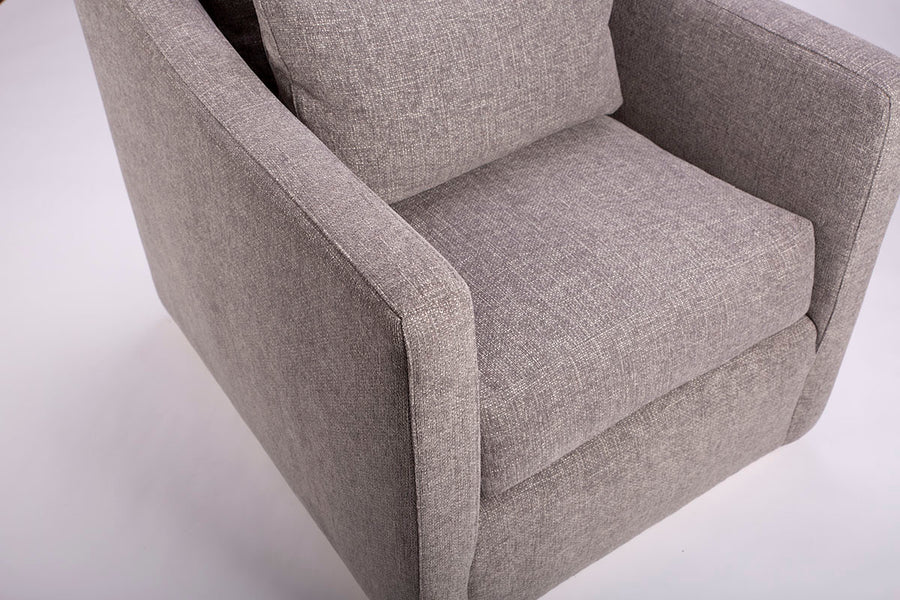 A light grey Rebecca Swivel lounge Chair with compact scale, gentle curves and supporting comfort of the double pillow back, closed up front view.
