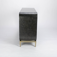 Wilhelm console that offers texture in the graphite gesso material, curvature for framing and a classic metal base to feature the unique design. Side view.