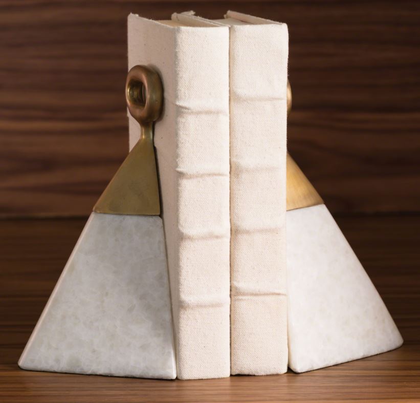 Pyramid shaped Equestrian Marble Bookends with white marble bases topped with a brushed brass stirrup detail.