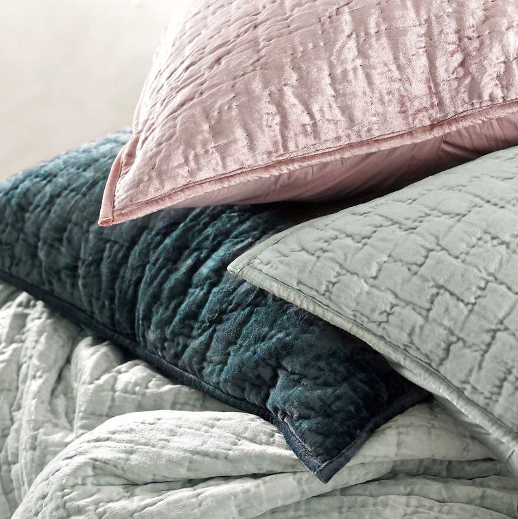 Pillows from Matte Velvet Juniper bedding Collection in various colors.