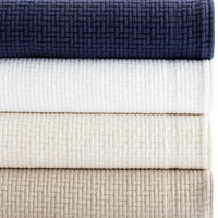 Color selection of the Interlaken Matelassé Coverlet - blue, white, beige and brown.