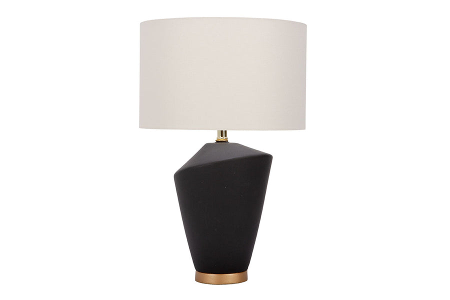 Gavin table lamp with a drum white shade and modern black ceramic body in an unique asymmetric design and a contrasting gold base.